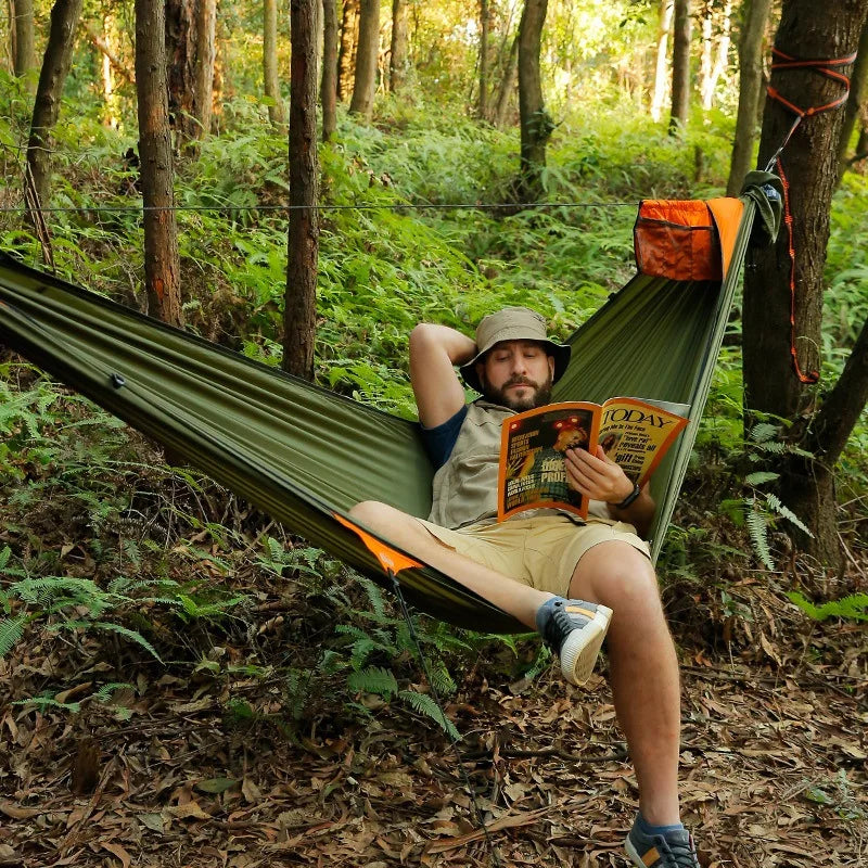 Travelers camping outdoors with mosquito net hammocks, increased anti roll over speed, anti mosquito hammocks